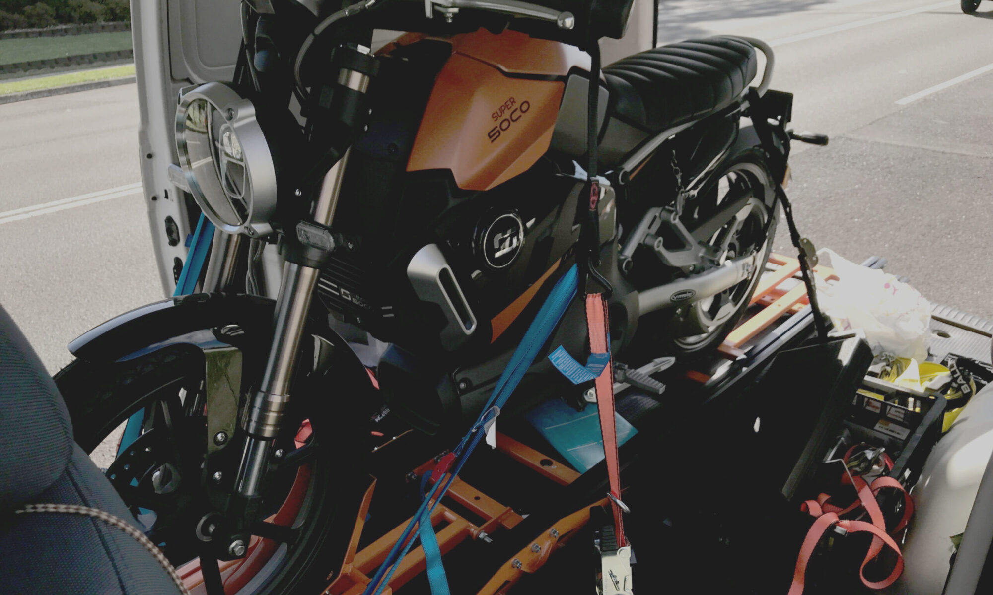 Brand new electric motorbike strapped in and ready to be delivered to new owner